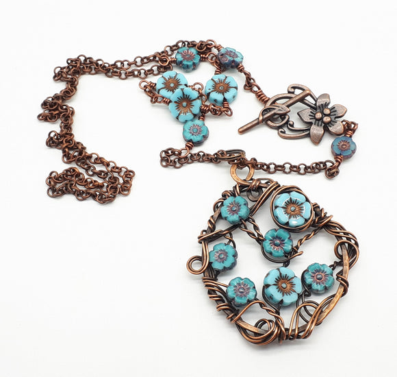 Blue hibiscus copper wire-wrapped necklace