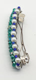 Teal, purple and blue  beaded flower pattern hair barrette on a white pearl base