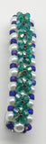 Teal, purple and blue  beaded flower pattern hair barrette on a white pearl base