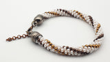 Metallic colors and white Kumihimo beaded bracelet