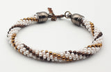 Metallic colors and white Kumihimo beaded bracelet