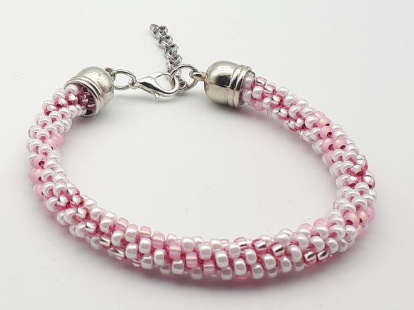 Pink and white Kumihimo beaded bracelet