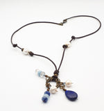 Gemstones and fresh water pearl leather necklace.