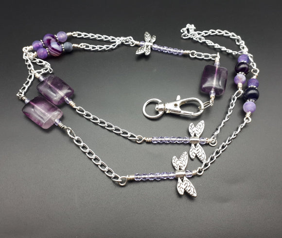 Lovely purple dragonflies lanyard. On a aluminium chain, purple fluorite,  agates and dragonflies were wire wrapped to complete this lanyard.